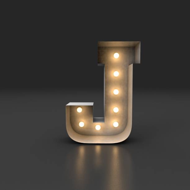 istock 3D Rendering. Retro white box letter J with filament bulb illuminated light reflected on a black background. 1364838247
