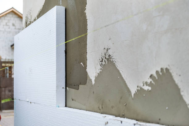 istock Installation of styrofoam insulation sheets on house facade wall for thermal protection. 1364839270