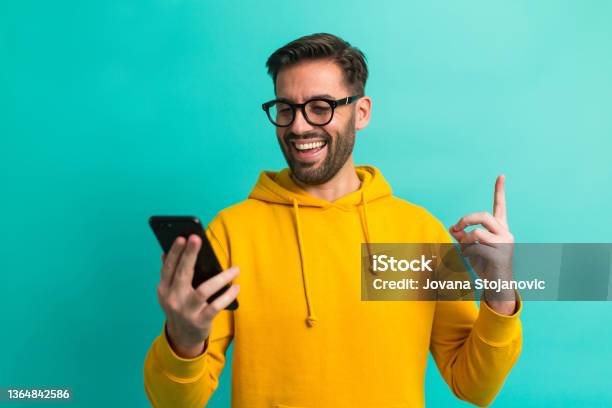 I Got A Message A Handsome Man With Eyeglasses And A Mobile Phone Stock Photo - Download Image Now