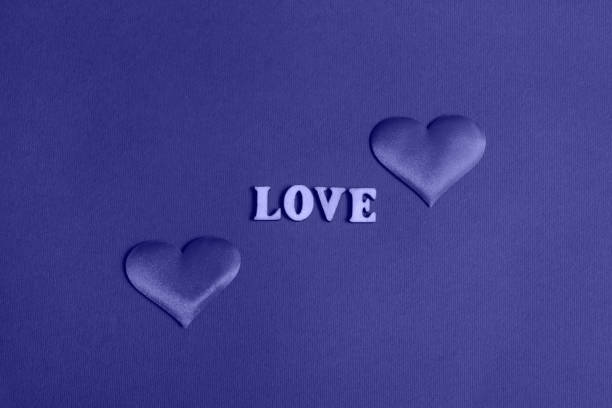 istock Composition for Valentine's Day. On a very peri  background, red hearts closeup with copy space 1364844135