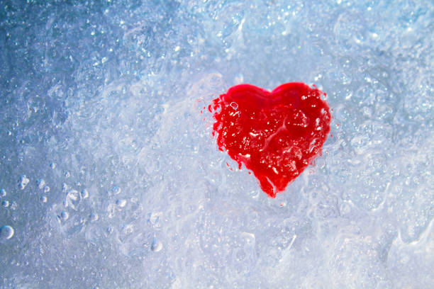 istock Red heart in ice. Close-up. Background. Texture. 1364845342
