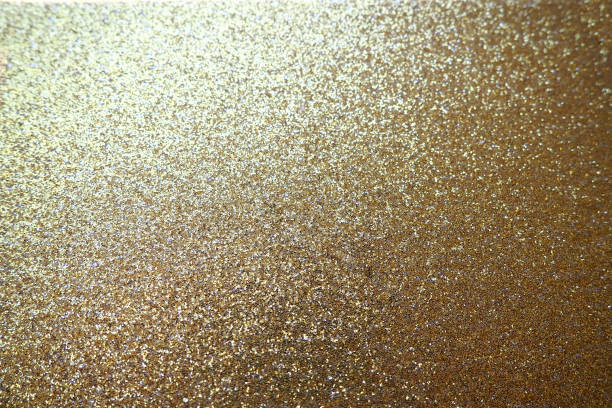 istock Gold close up. Golden glitter texture background. Sparkling glitter wrapping paper with sequins and sparkles. Festive golden bokeh and glitter. Beautiful background. Bokeh light of gold glitters 1364848640