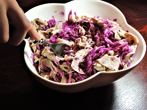 Thinly sliced pork boiled in water with red cabbage.