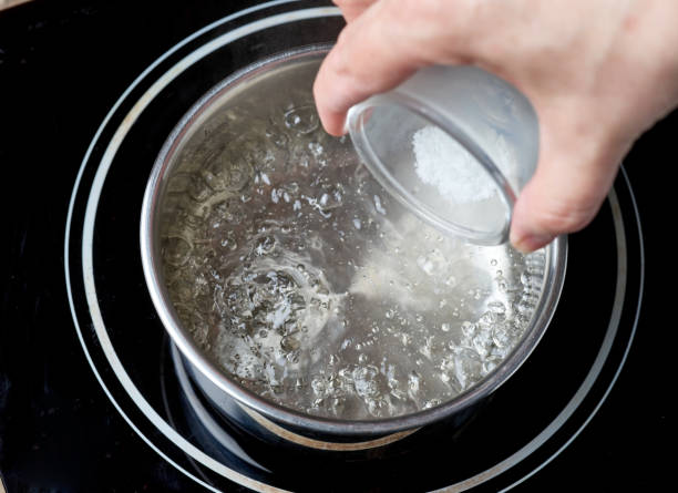 istock salt is added to boiling water 1364856688