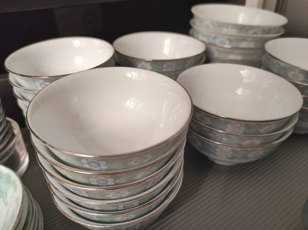 istock Pile of small white bowls on the kitchen drawer 1364859749