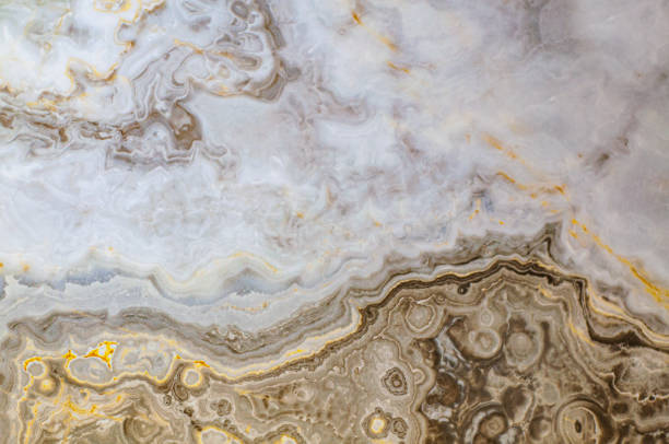istock Colored marble texture with beautiful abstract interlayers. Yellow, white and blue porcelain stoneware, background 1364860748