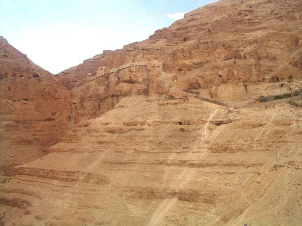 Jericho Caves Caves built into the mountain above Jericho, Palestine, and residences built for religious contemplation.  This is the place referred to in the Bible where Jesus Christ spent 40 days and nights in the desert.  This image was taken from the cable car in early Autumn. natural pattern pattern nature rock stock pictures, royalty-free photos & images