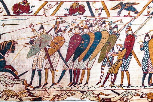 Colorful Medieval Bayeux Tapestry Bayeux Normandy France. Created 11th century right after Battle Hastings 1066 AD showing Norman Conquest England. Shows Battle and deaths in lower panel