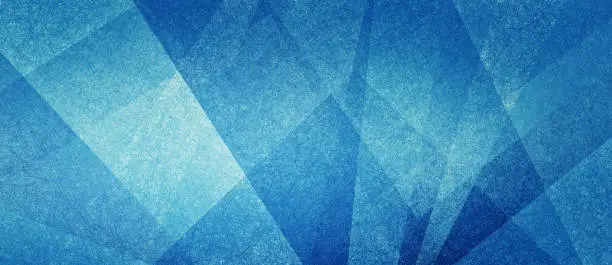 Photo of Abstract modern background in blue and white contemporary triangle and polygonal shapes layered in textured geometric art pattern