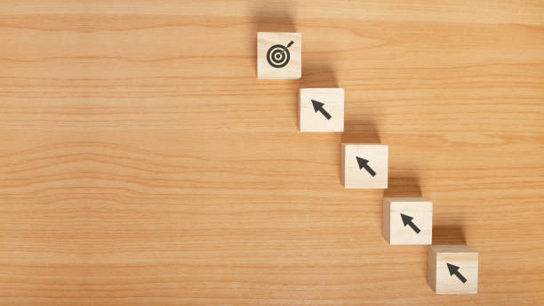 istock Arranging wood block stacking as step stair concept growth success process. 1364883704