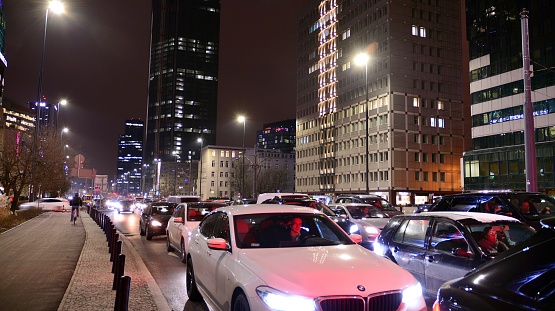 Warsaw, Poland. 11 January 2022. Cityscape in early night time with urban traffic. Street in the city in winter. Fast moving cars