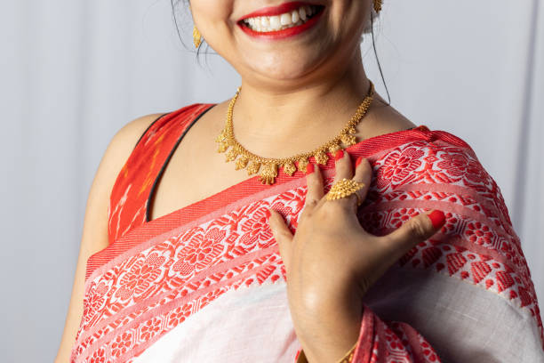 istock Indian woman with gold ornaments 1364896830