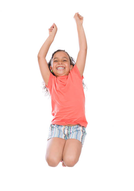 istock Beautiful Happy Girl Jumping 1364898777