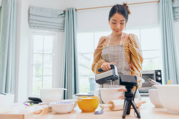 istock Vlogger or blogger influencer small business broadcasting cooking online concept 1364899636