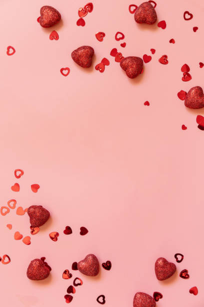 istock Valentines, love and wedding concept ideas. Frame red hearts on pink background. Flat lay, top view. Copy space. 1364899721