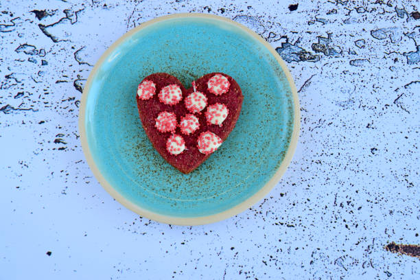 istock Heart-shaped red Valentine's cookies decorated with white chocolate and sprinkles 1364902248