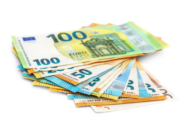 istock Different banknotes of euro on white background. 1364904202