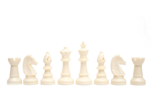 istock Set of white chess pieces are lined up isolated on a white background. 1364905372