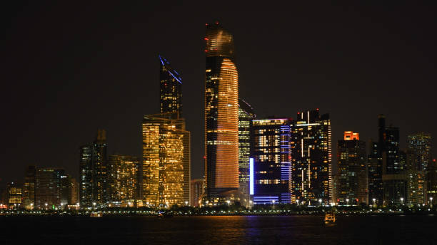 City skyline with big skyscrapers near the beach of Abu Dhabi, United Arab Emirates. stock photo