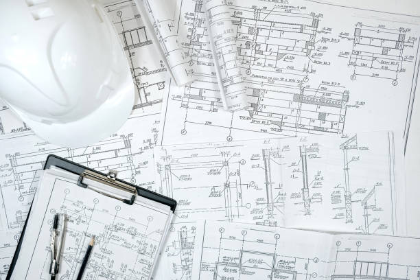 istock architect design working drawing sketch plans blueprints and making architectural construction model in architect studio,flat lay,architect background 1364909188