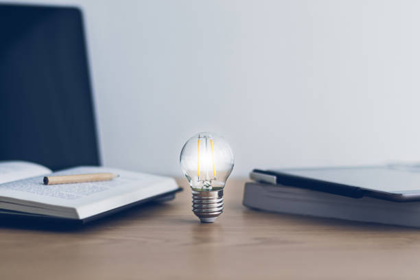 istock Bright light with book. Business success idea and studying concept 1364911276