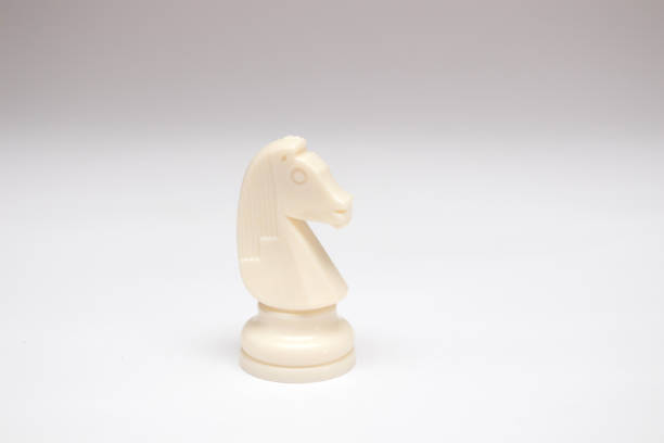 istock white Horse chess piece on white background 1364911410