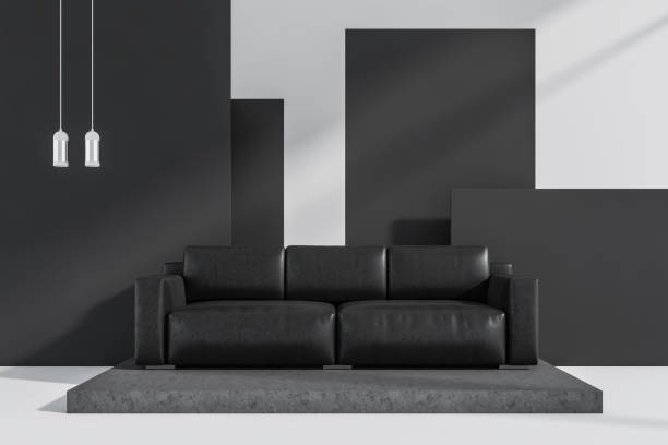 istock Dark living room interior with large black sofa 1364913825