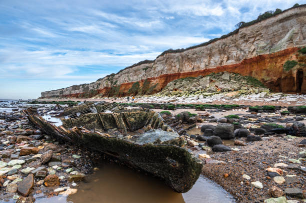 An old shipwreck of a trawler at Hunstanton cliffs in England