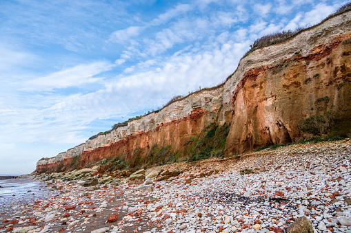 Orange and white layers of sediments at Hunstanton cliffs in England