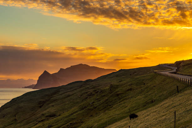 istock Sunset over a volcanic archipelago, Faroe Islands. 1364915001