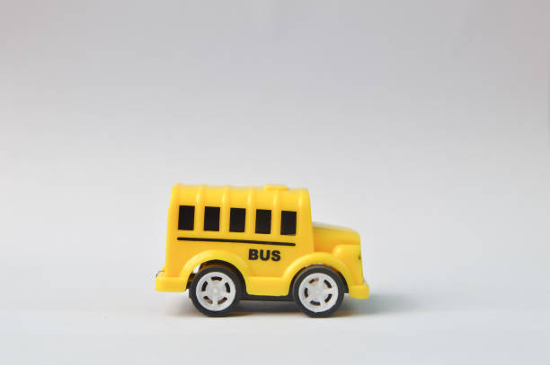 istock Yellow toy bus isolated on a white background 1364915142