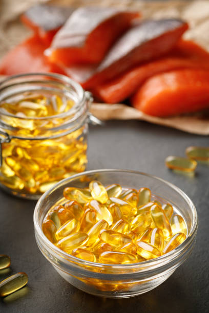 istock Omega 3 capsules and salmon red fish 1364915172