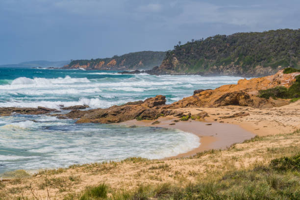 istock Rocks and splashes - seascape at Bermagui 1364915213