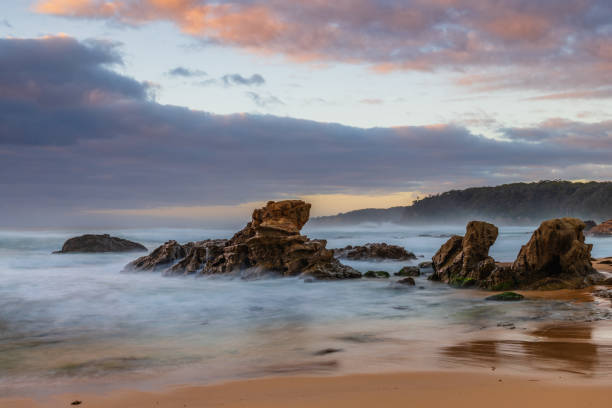 Rocks and waves - sunrise seascape at Bermagui