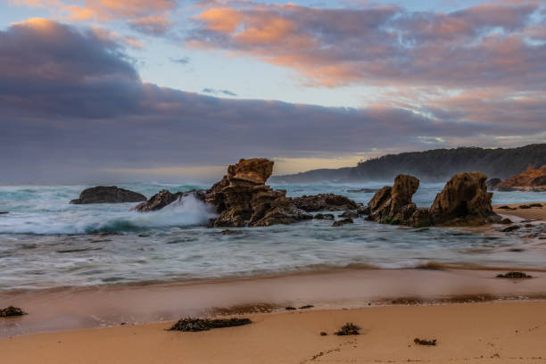 istock Rocks and waves - sunrise seascape at Bermagui 1364915377
