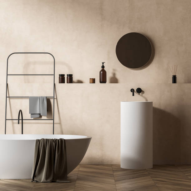 istock Light bathroom interior with sink and mirror, bathtub and towel ladder 1364915462