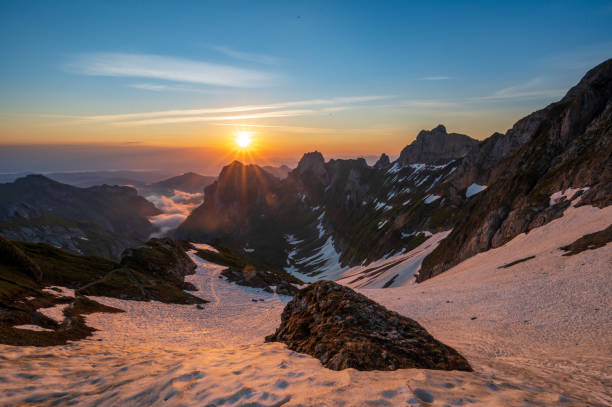 Sunrise in the snowy Swiss alps in Appenzellerland Beautiful sunrise in the snowy Swiss alps in Appenzellerland appenzell stock pictures, royalty-free photos & images