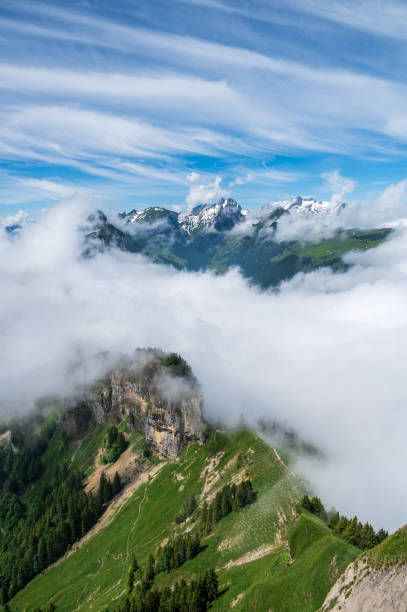 istock Mountain range seems like it is floating above the clouds 1364916436