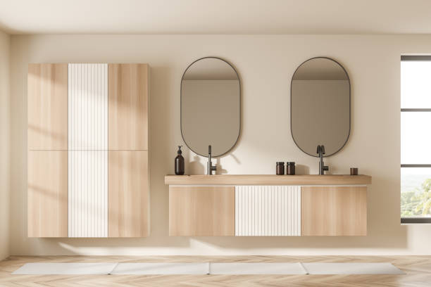 istock Light bathroom interior with sinks and mirrors, wooden shelf and window 1364916506