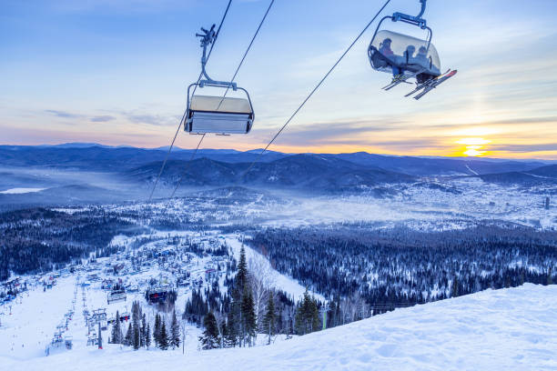 View from mount peak on Sheregesh ski resort and Altai mountains or Gornaya Shoria. Active winter rest, skiers and snowboarders on ski slope and Ski lift, nature and sport leisure. View from mount peak on Sheregesh ski resort and Altai mountains or Gornaya Shoria. Active winter rest, skiers and snowboarders on ski slope and Ski lift, beautiful nature and sport leisure. Sheregesh stock pictures, royalty-free photos & images