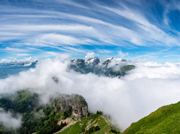 istock Mountain range seems like it is floating above the clouds 1364916633