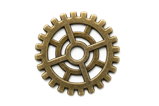 Old Gears made of copper or brass isolated on white. Macro shot.