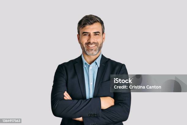 Businessman Smiling With Arms Crossed On White Background Stock Photo - Download Image Now