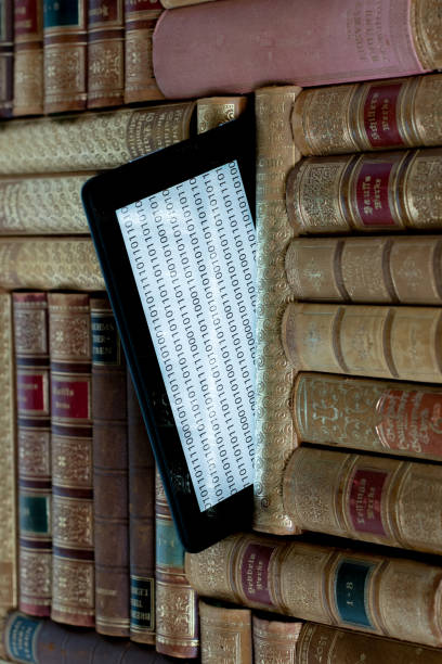 istock old books on the shelf with a tablet in between 1364917807