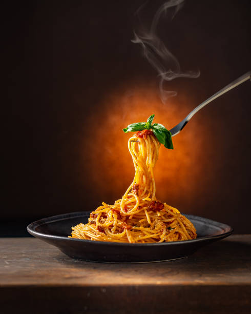 istock Spaghetti pasta bolognese in black plate. 1364918824