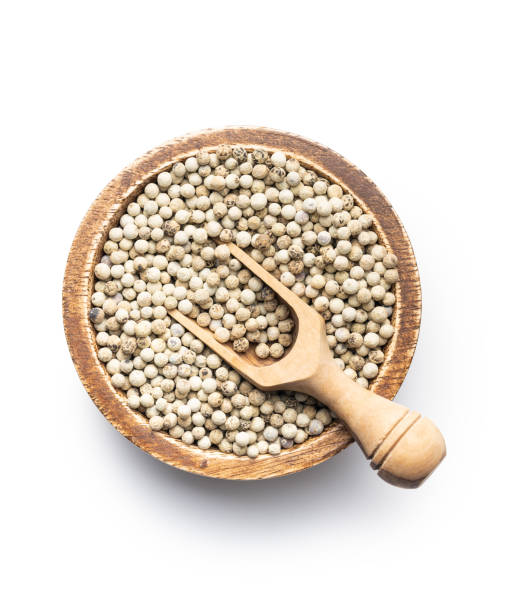 istock Whole pepper spice. White peppercorn grain in bowl 1364919963