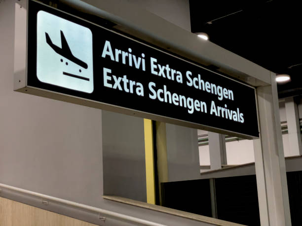 Shengen passengers entrance in Ciampino Airport, Rome, Italy. A sign at Ciampino airport in Rome, Italy, indicates the entrance for for passengers from the Schengen area in Europe.  No people. schengen agreement stock pictures, royalty-free photos & images
