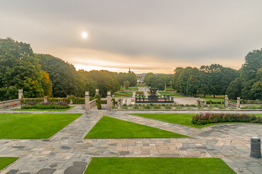 Oslo, Norway - September 24, 2021: Beautiful sunny view on Park Frogner with Vigeland installation. The Vigeland installation is name of the sculpture installation in the central part of Frogner Park.