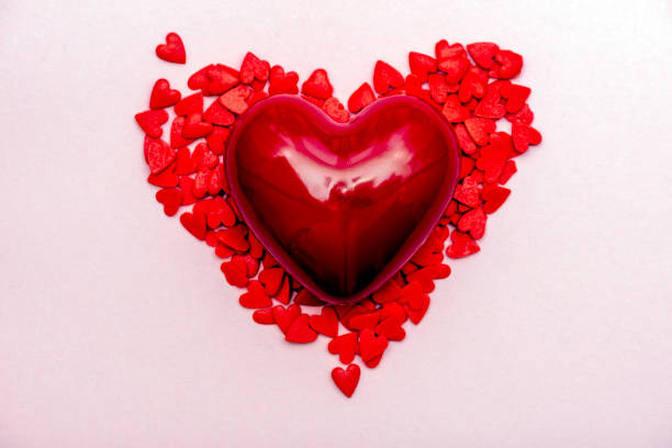 istock red heart on a pink background 1364924811