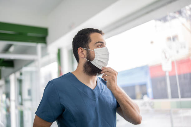 istock Nurse looking away contemplation on a vaccination center 1364925019